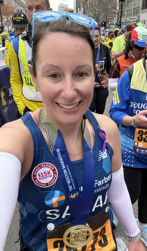 Sarah Boston Marathon Finish with smile and medal